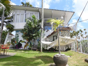 Surga Tropical Suites